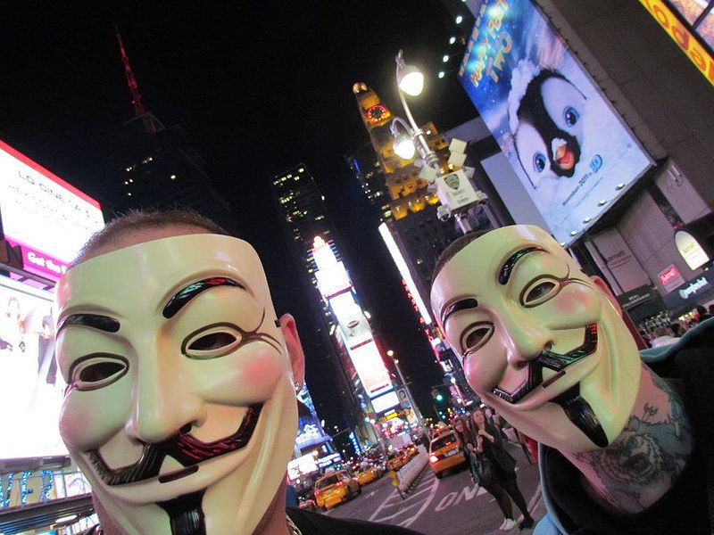 Two Occupy Wall Street protestors in masks, in Times Square