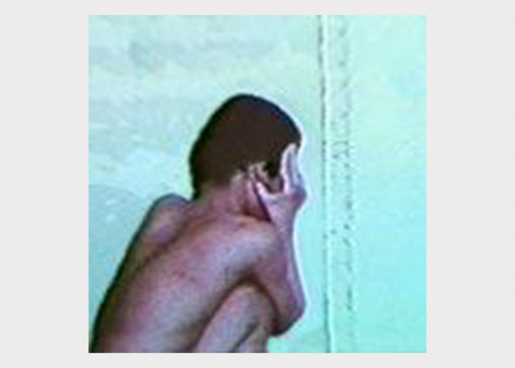 naked man crouching