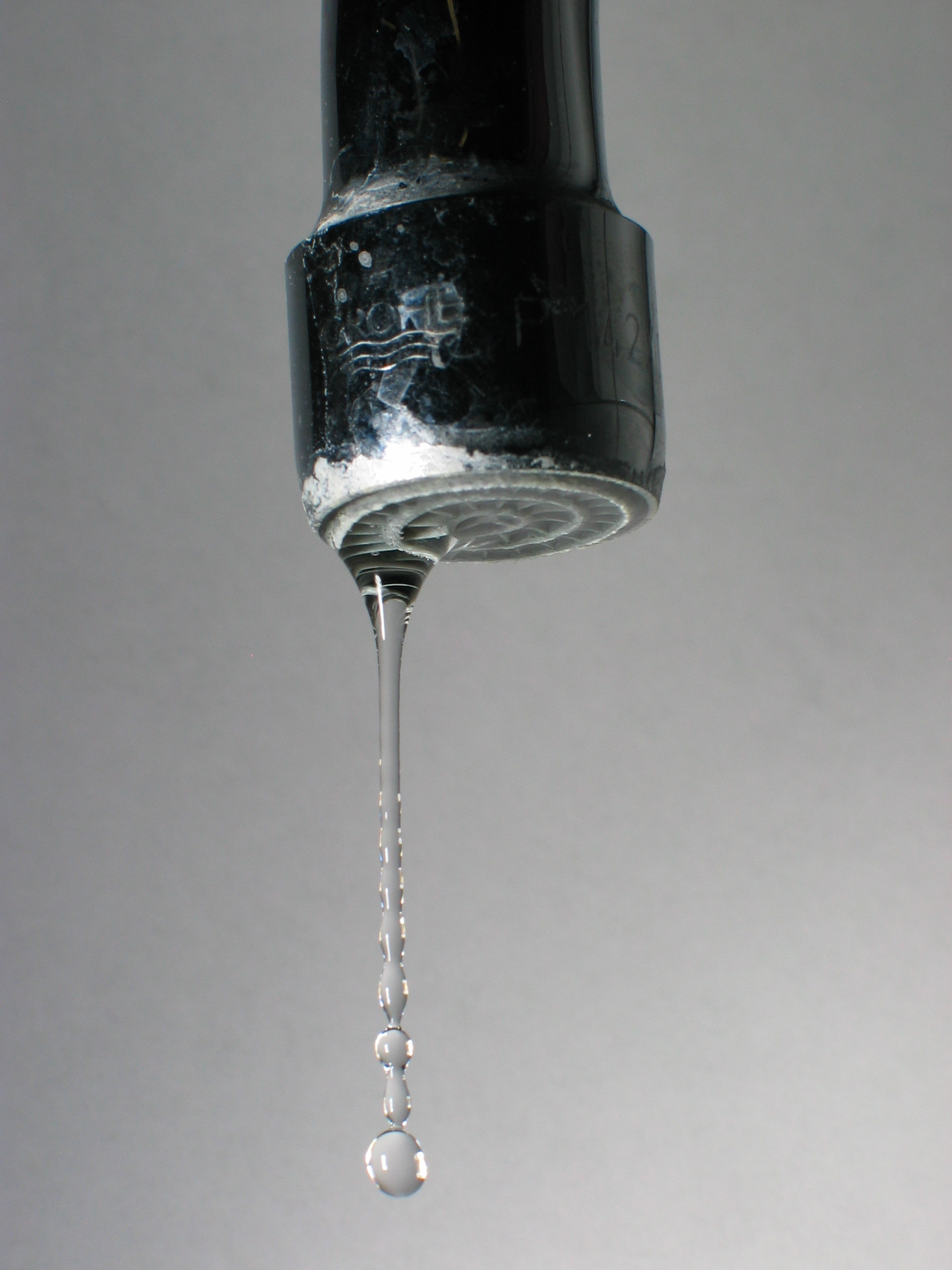 A dripping water faucet